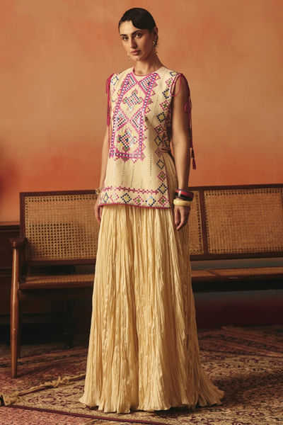 Beige pink embroidered top and lehenga