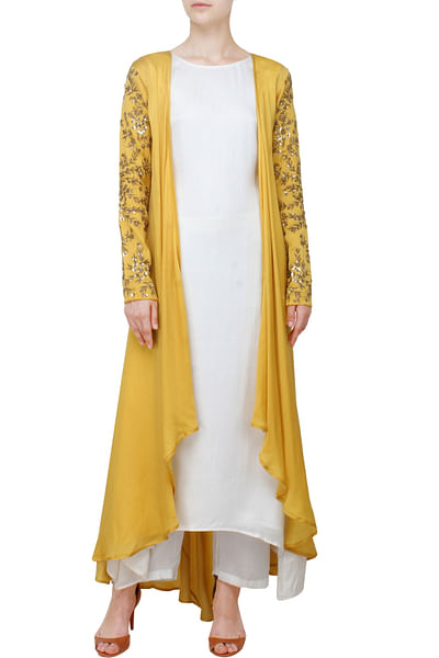 Mustard cape-style jacket with white kurta and palazzos