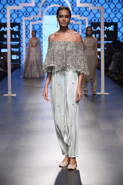 Cutwork embroidered cape with low-crotch pants