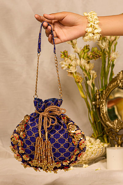 Blue floral applique and embellished potli bag