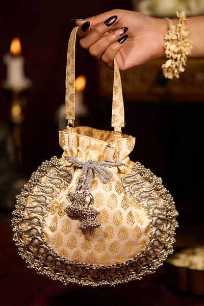 Off-white floral-peacock beaded potli bag