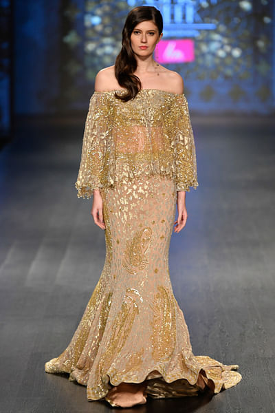Gold georgette lehenga with cape blouse