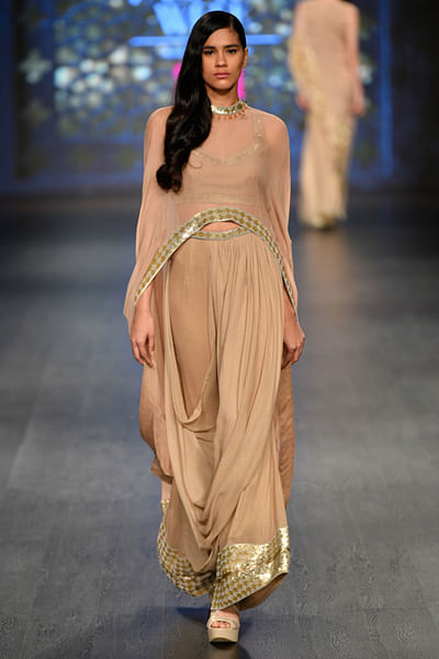 Gold dhoti with blouse and cape