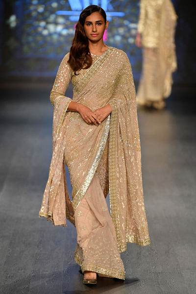 Gold saree with drape