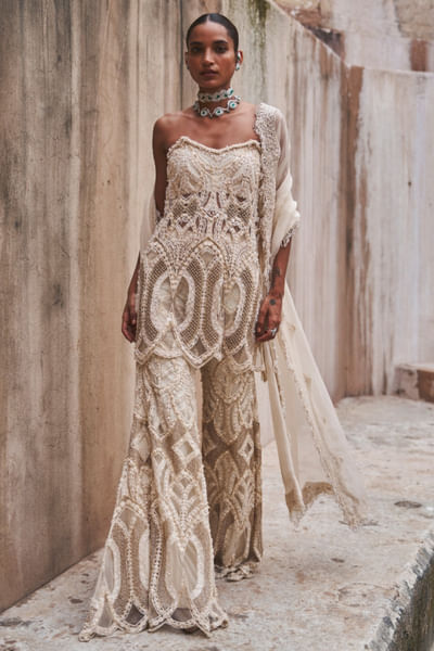 Ivory geometric embroidered peplum-trouser set