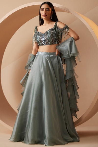 Green embellished blouse and lehenga set
