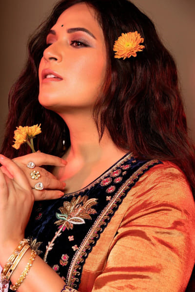 Gold floral motif bangle