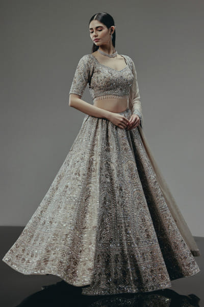 RA'KAIRA Champagne gold hand embellished lehenga set RAKAMAY26D145101