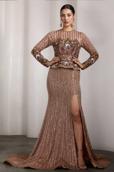 Nude embellished peplum gown