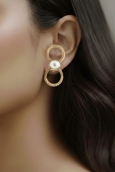 Gold and pearl knotted earrings