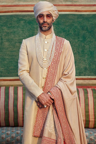 Beige sherwani with tiger buttons