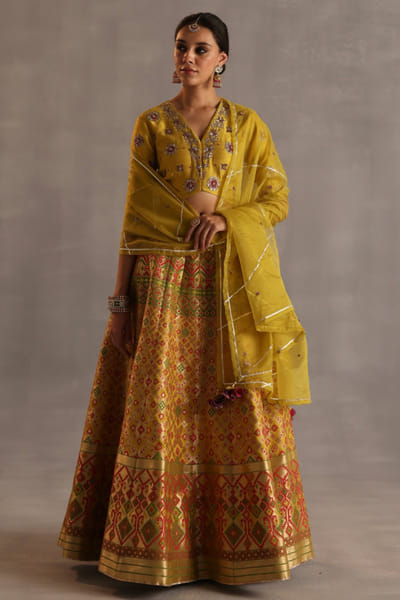 Yellow hand embroidered lehenga set