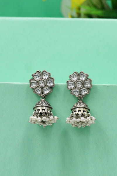 White floral kundan jhumka earrings