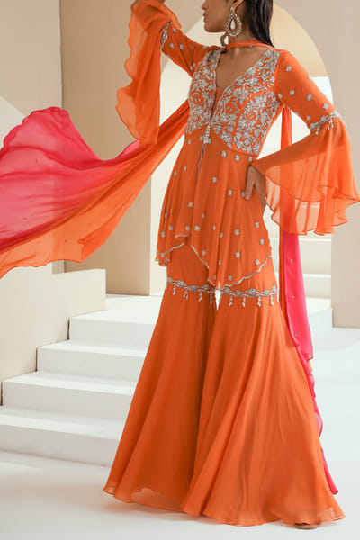 Orange embellished peplum top and gharara set
