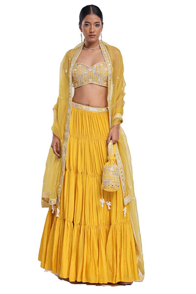 Yellow embroidered and tiered lehenga set