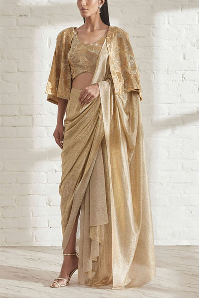Gold draped sari and cape