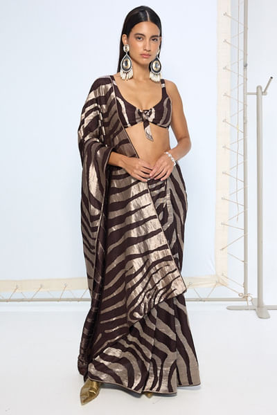 Brown and silver animal print zari weave sari