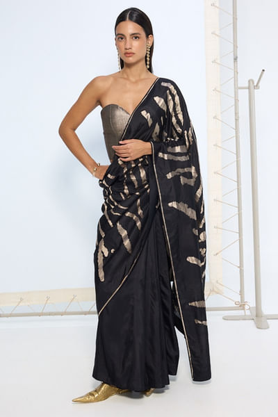 Black and silver animal print zari weave sari