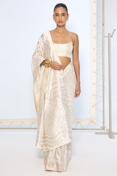 Ivory animal print zari weave sari