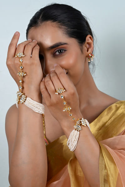 Shlok Jewels White and gold kundan haath phools SHLOJUN26D247736