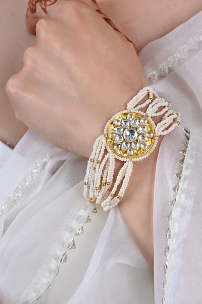 White kundan embellished bracelet