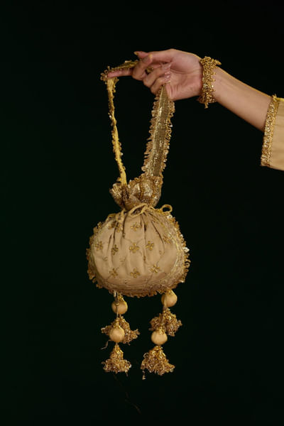 Beige aari embroidered potli bag
