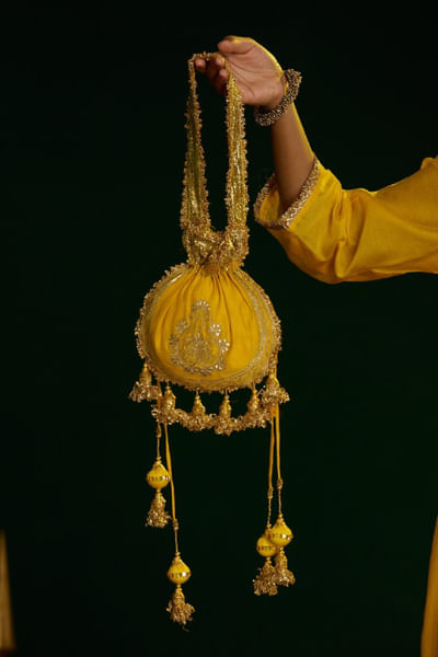 Yellow aari embroidered potli bag
