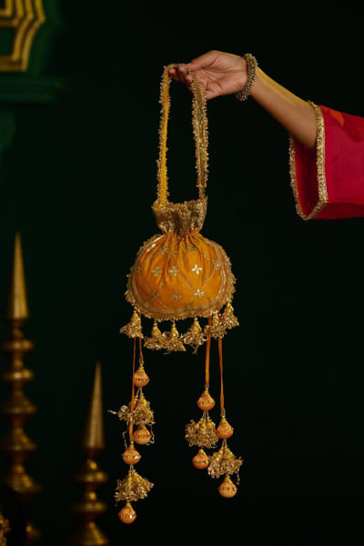 Orange and marigold floral potli bag