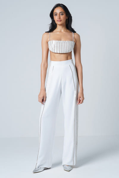 White and grey striped faux leather trousers