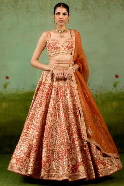 Rust orange embroidered raw silk lehenga set