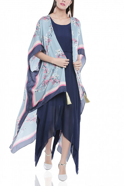 Asymmetric dress with a floral cape