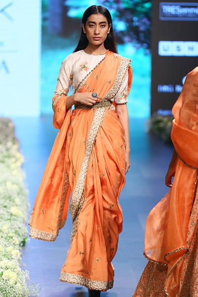 Embroidered sari, printed blouse paired with embroidered pants and belt