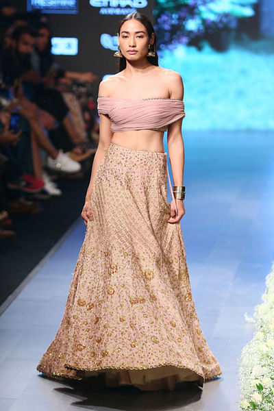 Heavily embroidered lehenga with off-shoulder blouse