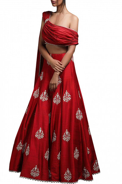 Red handcrafted lehenga and one shoulder draped blouse set