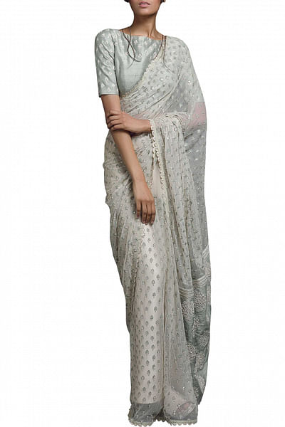 Beige embellished net sari and mint green blouse