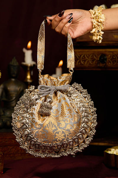 Grey peacock-beaded and tasselled potli bag