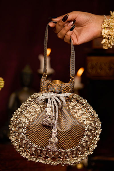 Brown peacock-beaded and tasselled potli bag