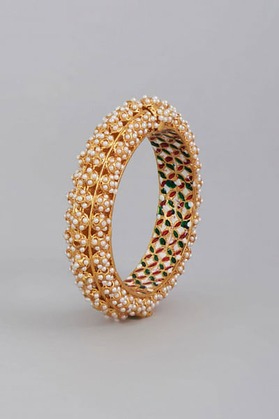Gold finish pearl embellished bangle