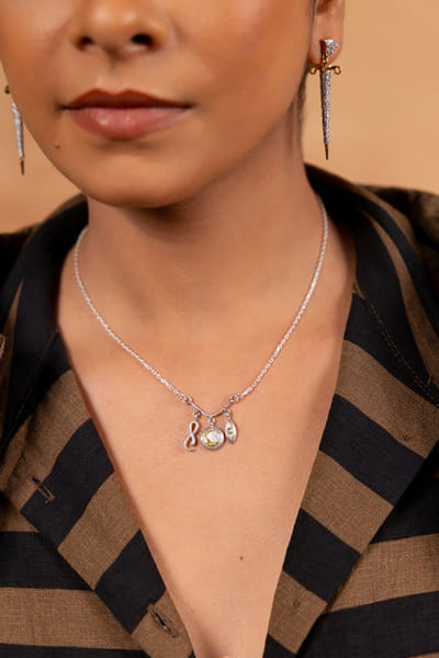 Silver and gold charm-embellished necklace