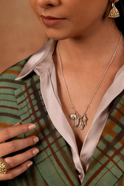 Gold and silver charm-embellished necklace