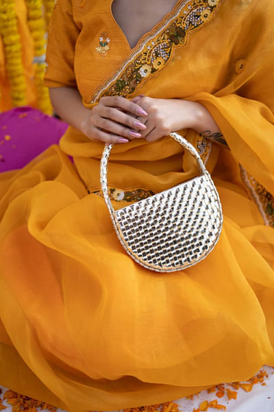 Gold woven textured handbag