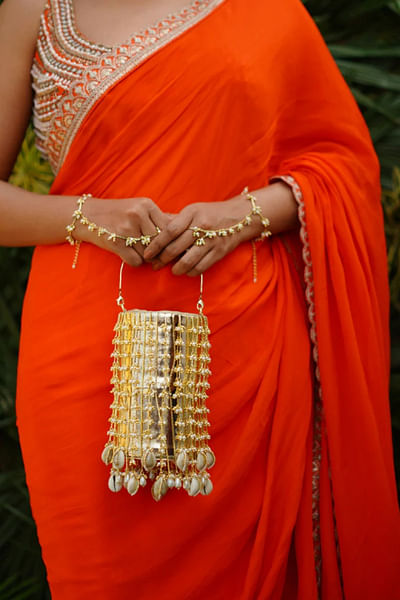 Gold bead embellished bucket bag