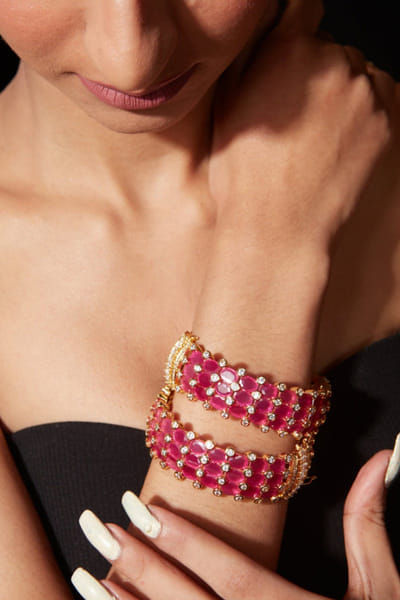 Gold plated pink stone encrusted bangles