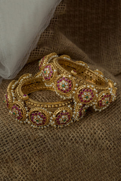 VIVINIA by Vidhi Mehra Gold and pink kundan polki embellished bangles VIVAUG25D132301