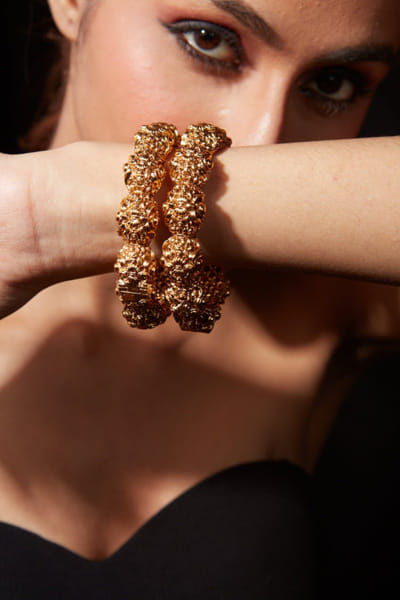 Gold toned textured bangles