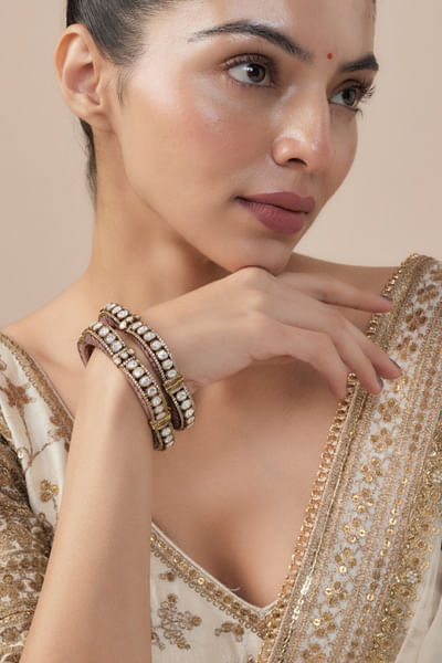 Gold and pink stone embellished bangles
