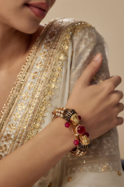 Gold and red stone embellished kada