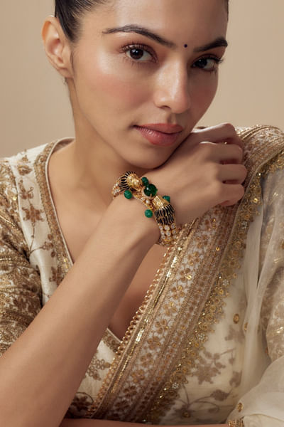 Gold and green gemstone embellished kada