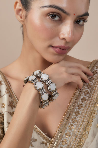 Gold and white stone embellished bangles