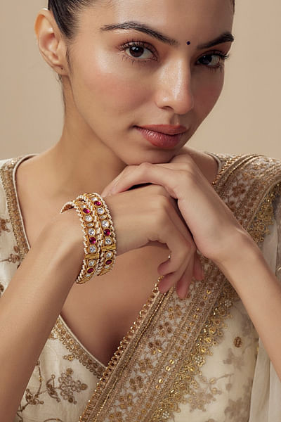 Gold and pink kundan embellished bangles